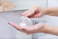 Female hands using wash hand sanitizer gel pump dispenser. Royalty Free Stock Photo