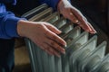 Female hands warming on oil heater at home close up. Cold winter with radiator. Heating season Royalty Free Stock Photo