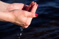 In the female hands water from the lake Royalty Free Stock Photo