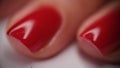 Female hands with well-groomed red nails closeup