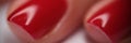 Female hands with well-groomed red nails closeup