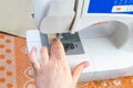 Female hands work on a sewing machine, sewing coffee towel. Close-up Royalty Free Stock Photo