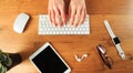 Female hands working with modern white keyboard and mouse on wooden background, top view  - Image Royalty Free Stock Photo
