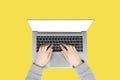 Female hands working on new laptop with blank screen isolated on illuminating yellow background Royalty Free Stock Photo