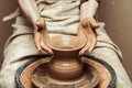 Female hands working on potters wheel