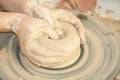 Female hands working on pottery wheel Royalty Free Stock Photo