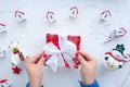 Female hands are wrapping a Christmas present Royalty Free Stock Photo