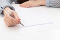 Female hands write on a piece of paper when the crisis is over Royalty Free Stock Photo