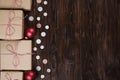 Christmas gifts box presents with red balls on wooden background Royalty Free Stock Photo