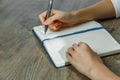 Female hands are writing in a notebook Royalty Free Stock Photo