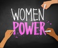 Female hands writing Women Power slogan