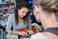 female hardware store assistant seaching for code Royalty Free Stock Photo