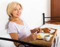 Female having breakfast in bed Royalty Free Stock Photo