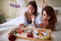 Female having breakfast in bed Royalty Free Stock Photo