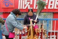 Female hawker selling small crafts and toys, adobe rgb