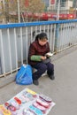 Female hawker selling handmade insoles in winter, adobe rgb