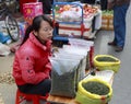 Female hawker selling tieguanyin tea Royalty Free Stock Photo