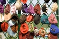 Many female headdresses are placed in a show-window.