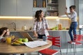 Mother telling son to stop slamming door of cupboard Royalty Free Stock Photo