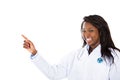 Female health care professional pointing at copy space Royalty Free Stock Photo