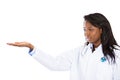 Female health care professional pointing at copy space Royalty Free Stock Photo
