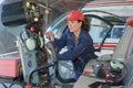Female helicopter mechanic at work