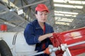 Female helicopter mechanic working hard Royalty Free Stock Photo