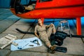 Female helicopter technician tired at work. gender equality.