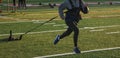 High School runner pulling a wieghted sled Royalty Free Stock Photo
