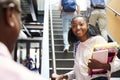 Female High School Student Talking With Teacher In Busy Corridor Royalty Free Stock Photo