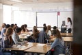 Female High School Teacher Standing By Interactive Whiteboard Teaching Lesson Royalty Free Stock Photo