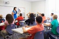 Female High School Teacher Taking Class