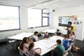 Female High School Tutor Standing By Table With Students Teaching Lesson Royalty Free Stock Photo