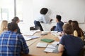 Female High School Tutor At Whiteboard Teaching Maths Class Royalty Free Stock Photo