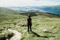 Female hiker admiring the landscape on a path