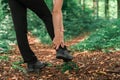 Female hiker with ankle injury in forest Royalty Free Stock Photo