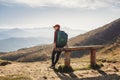 Female Hiker With Backpack in Front of Landscape Valley View on the Top of a Mountain Royalty Free Stock Photo