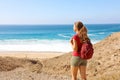 Female hiker backpacker enjoying view of empty beach in Fuerteventura, Canary Islands Royalty Free Stock Photo