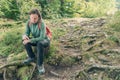 Female hiker checking on smart fitness tracker