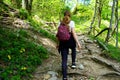 Female hiker climbing through the forest Royalty Free Stock Photo