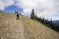 Female hiker heading up mountain path Royalty Free Stock Photo