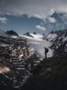 A female hiker is hiking descending a glacier in the ÃÂ¶tztal