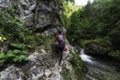 Female hiker on hiking trail in rocky canyon. Prosiecka valley in Slovakia Royalty Free Stock Photo