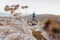 Female hiker looking out over views from high cliffs to valleys below Royalty Free Stock Photo