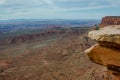 Female Hiker Looks Down Over Grand View in Island in the Sky