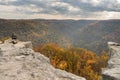 Female Hiker overlooks forest at Coopers Rock State Park WV