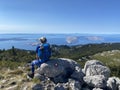 Female hiker on peak in Velebit mountain.