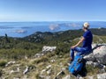 Female hiker on peak in Velebit mountain.