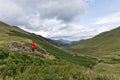 Female Hiker in Red Jacket enjoying the view, in The Lake District UK Royalty Free Stock Photo