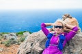 Female hiker resting on rock, Crete Island, Greece Royalty Free Stock Photo